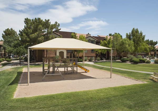 Children's playground with slides and swings at Avana Gilbert luxury apartments, perfect for family-friendly outdoor activities