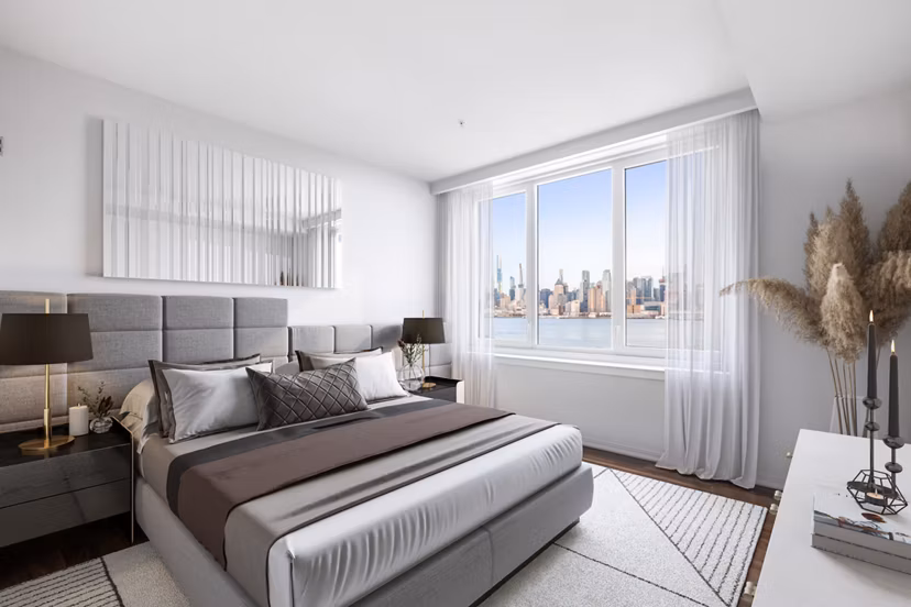 Spacious bedroom with modern decor and ample natural light at Estuary Apartments