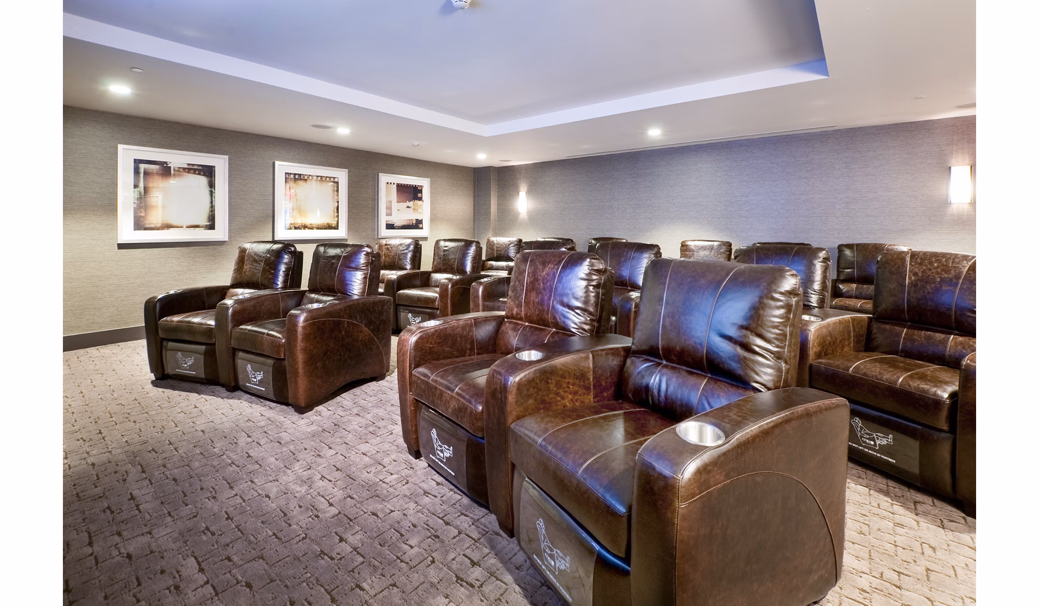 Theater room featuring luxury seating and large screen at Estuary Phase II Apartments