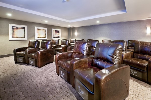 Theater room featuring luxury seating and large screen at Estuary Phase II Apartments