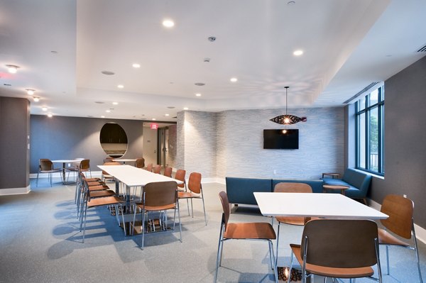 Contemporary clubhouse featuring modern decor and seating at Estuary Phase II Apartments, a luxury Greystar property