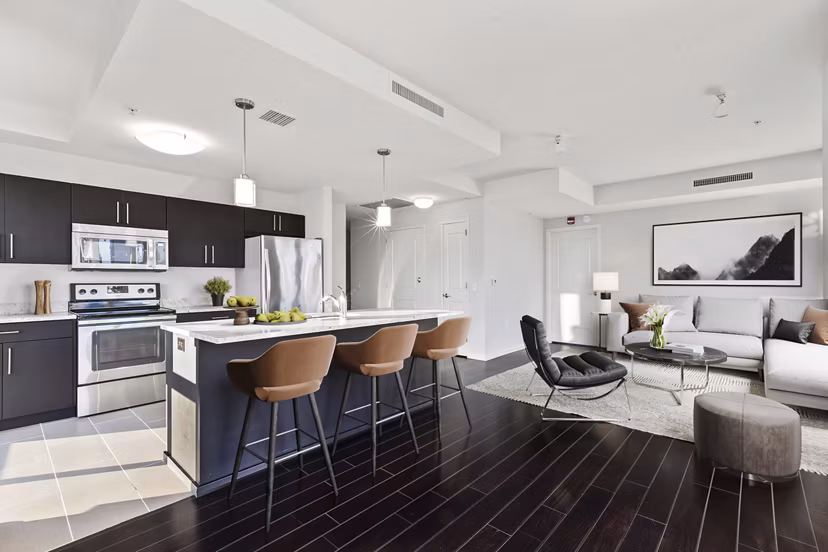 Modern kitchen with stainless steel appliances at Estuary Apartments