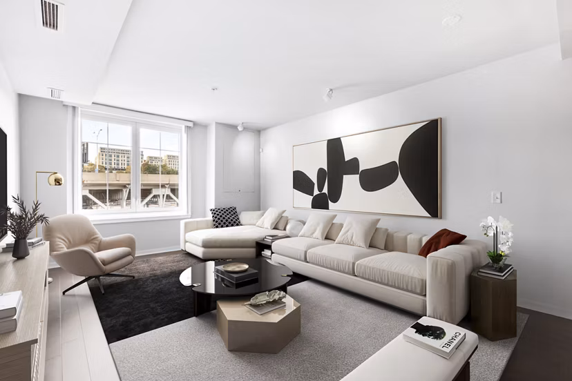 Spacious living room with natural light and modern furnishings in Estuary Phase II Apartments