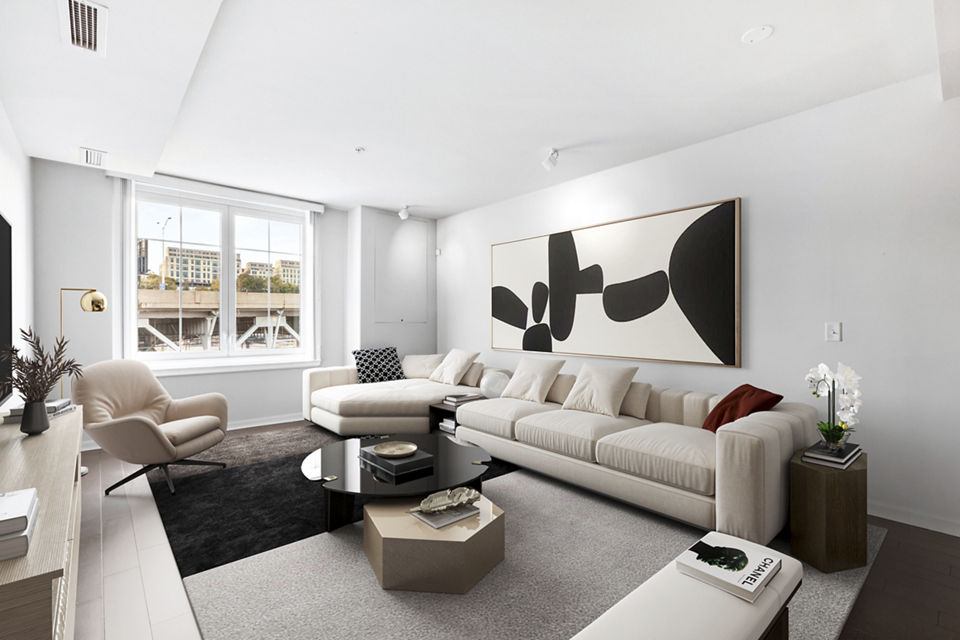 Spacious living room with natural light and modern furnishings in Estuary Phase II Apartments