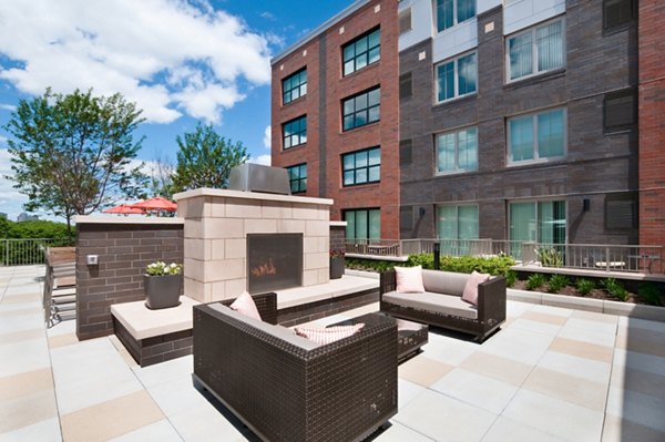 Cozy fire pit area at Estuary Apartments featuring comfortable seating and outdoor ambiance