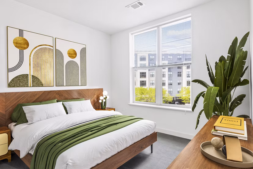 Elegant bedroom with modern decor at West of Chestnut Apartments