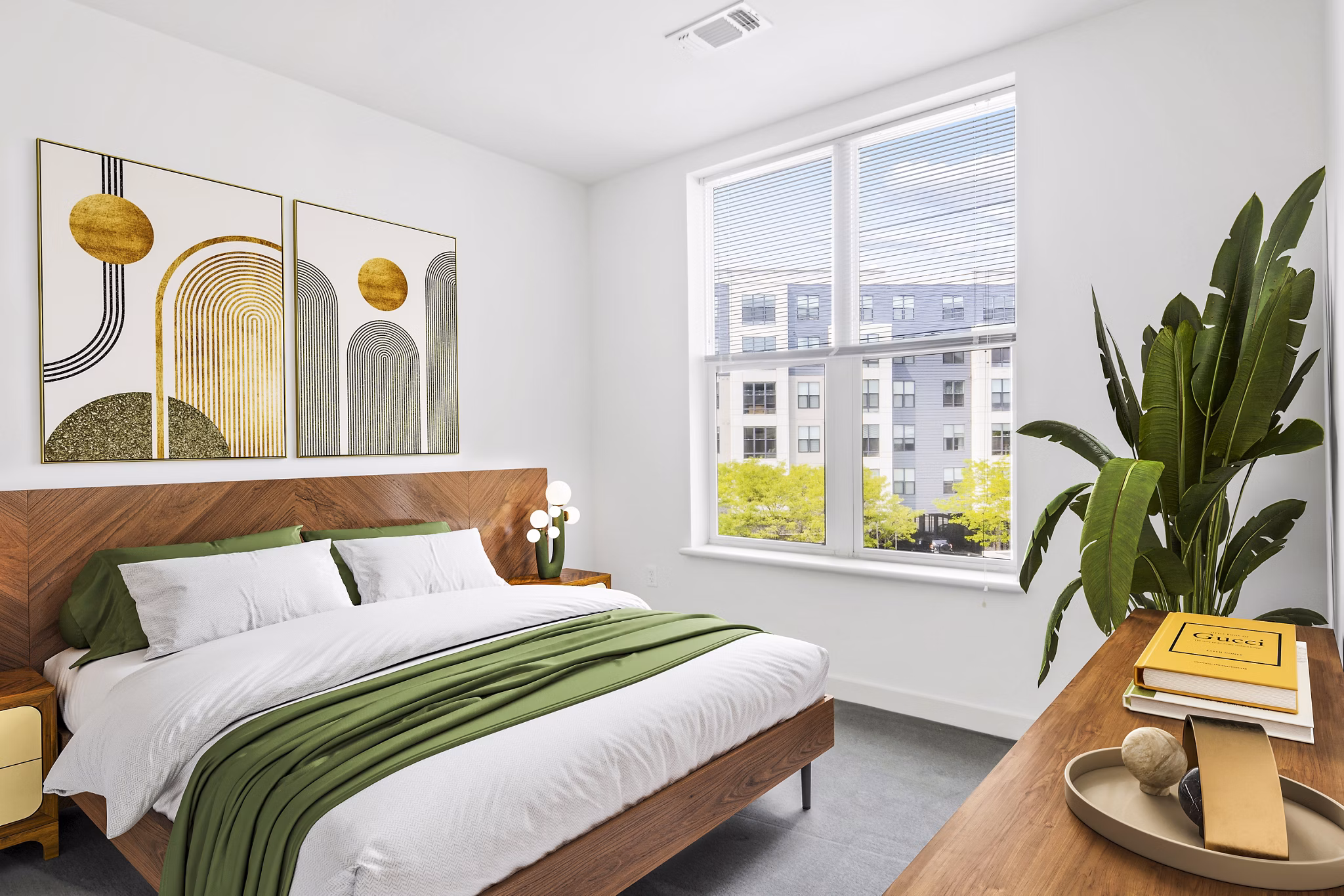 Elegant bedroom with modern decor at West of Chestnut Apartments