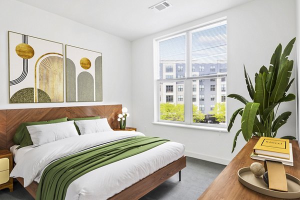Elegant bedroom with modern decor at West of Chestnut Apartments