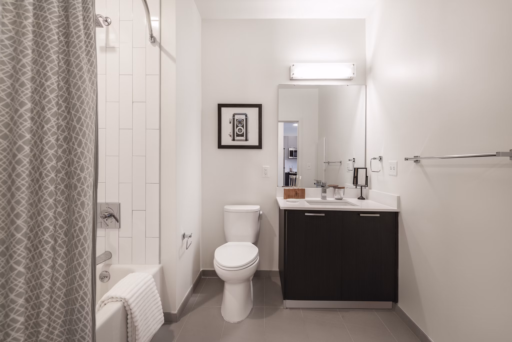 Luxury bathroom featuring sleek fixtures in West of Chestnut Apartments