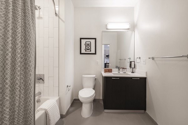 Luxury bathroom featuring sleek fixtures in West of Chestnut Apartments