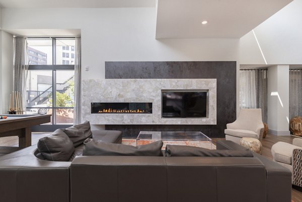 Clubhouse featuring modern design and seating areas at West of Chestnut Apartments in Greystar community