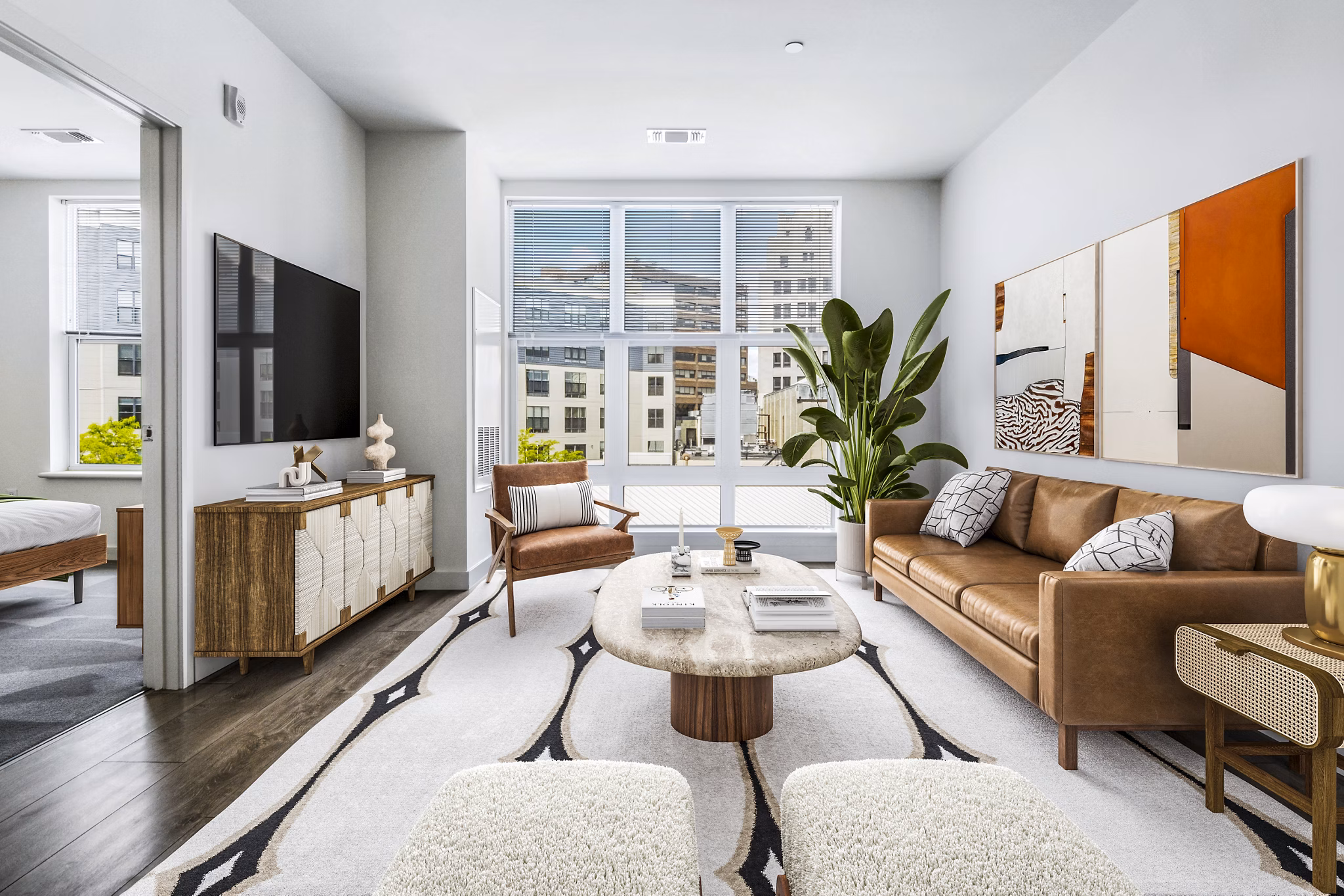 Spacious living room with modern design elements in West of Chestnut Apartments