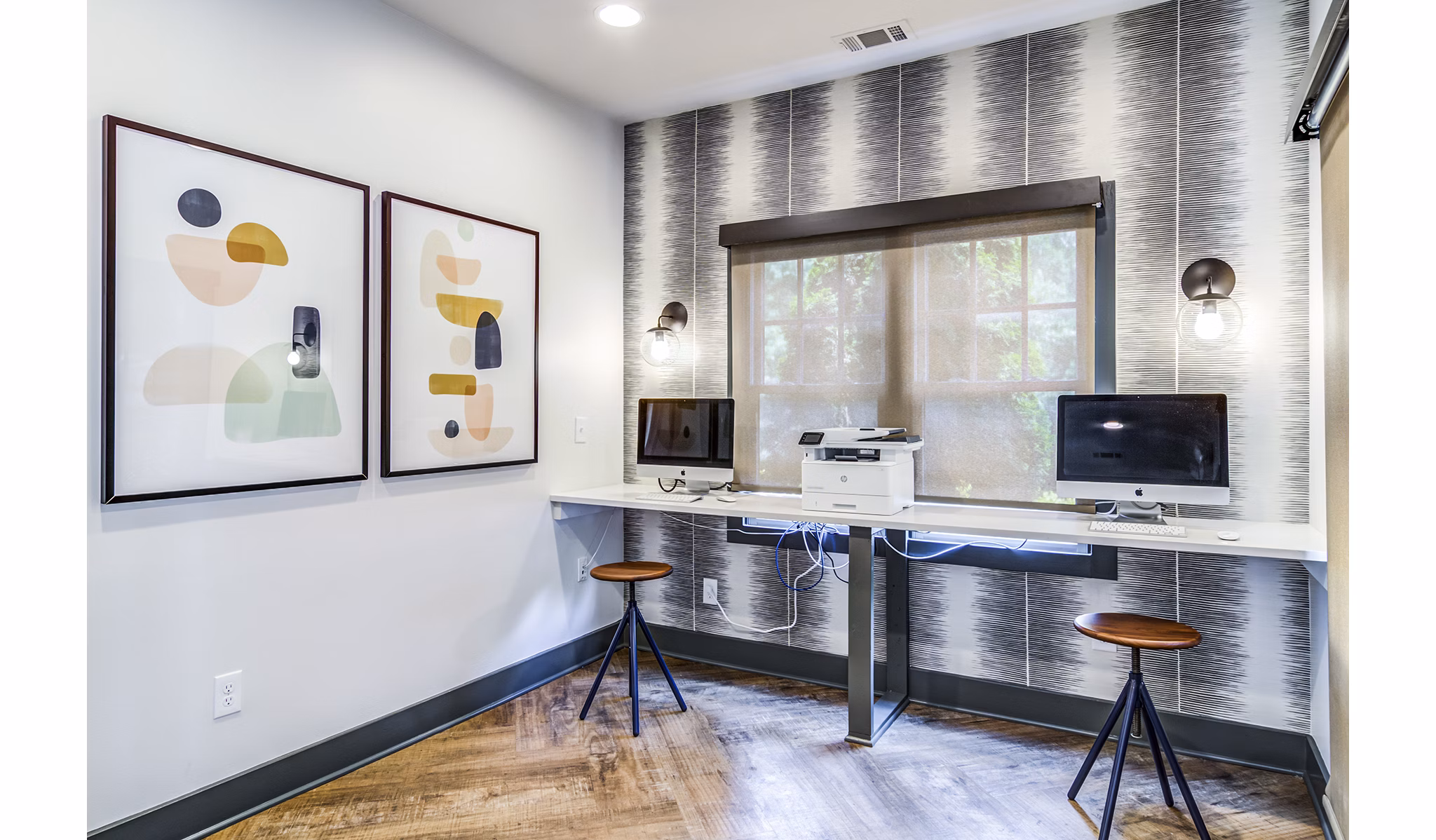 Modern business center with workstations at Avana Woods Apartments, ideal for remote work and meetings