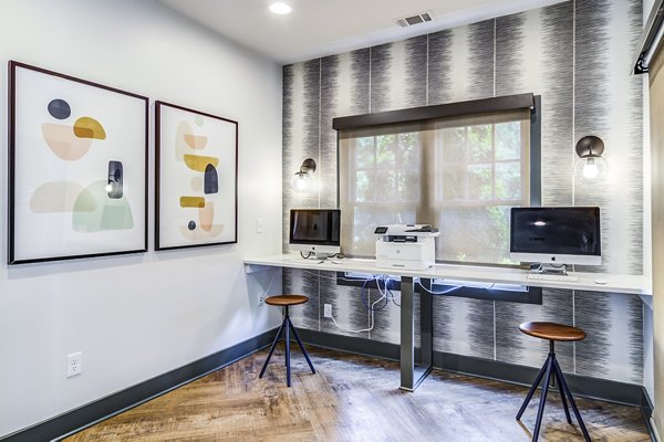 Modern business center with workstations at Avana Woods Apartments, ideal for remote work and meetings
