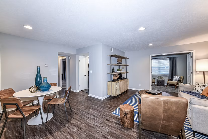 Avana Woods Apartments: Elegant dining room with modern furnishings and stylish lighting features