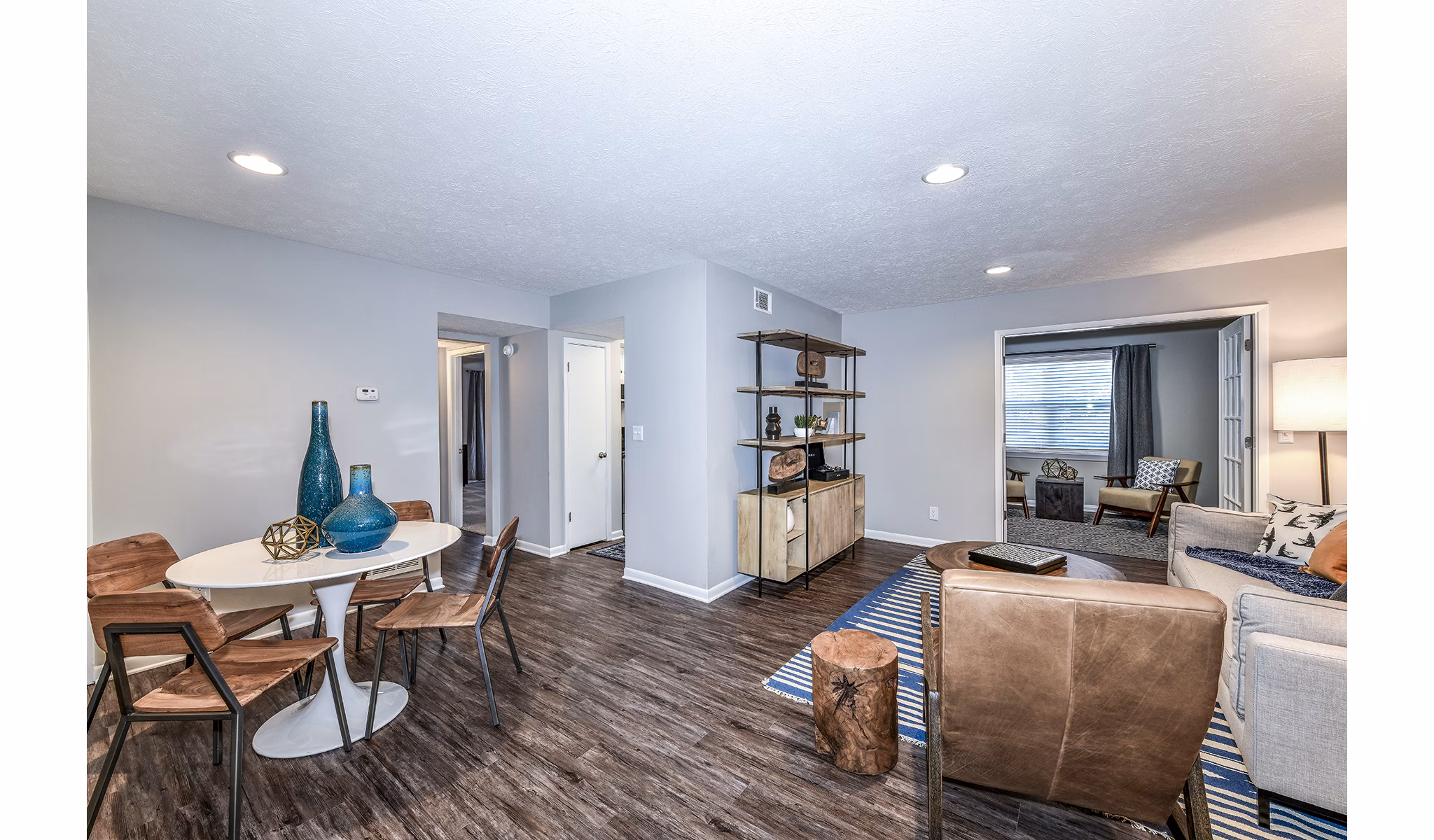 Avana Woods Apartments: Elegant dining room with modern furnishings and stylish lighting features