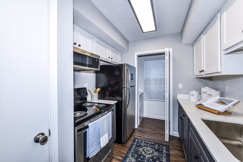 Spacious kitchen with modern appliances at Avana Woods Apartments, a Greystar luxury apartment community
