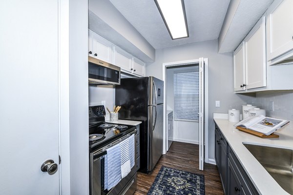 Spacious kitchen with modern appliances at Avana Woods Apartments, a Greystar luxury apartment community