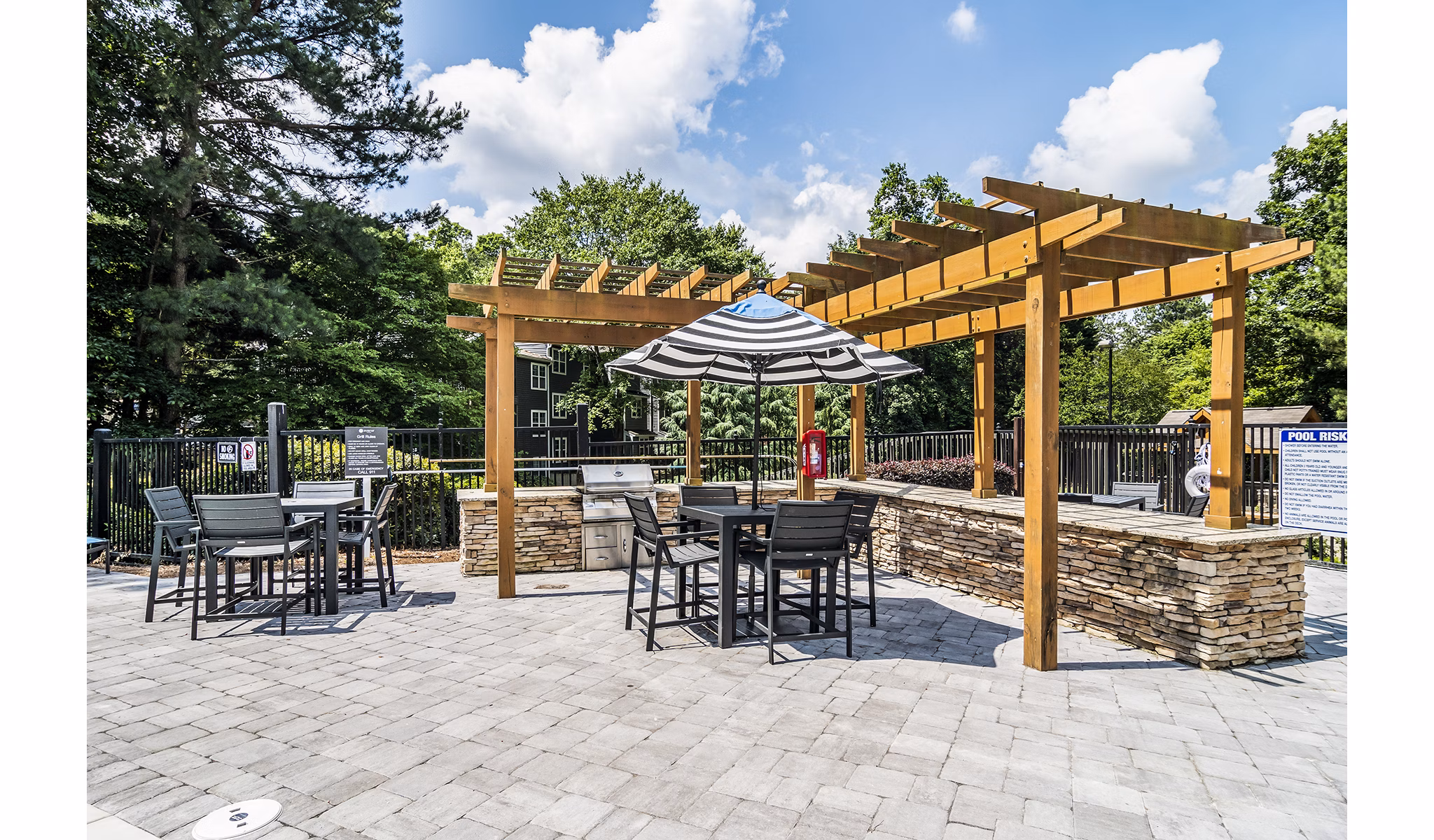 Outdoor barbecue grill area at Avana Woods Apartments, perfect for social gatherings and culinary adventures