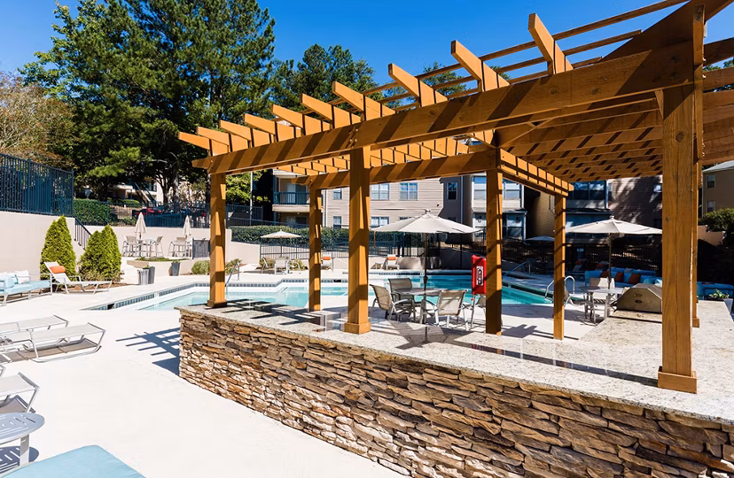 Serene outdoor pool at Avana Woods luxury apartments, perfect for relaxation and leisure