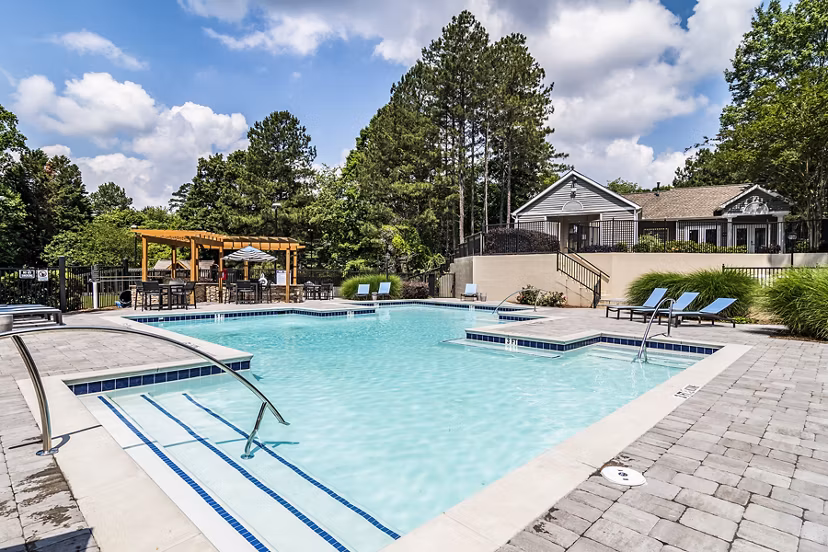 Relaxing outdoor pool at Avana Woods Apartments, perfect for leisure and exercise in a tranquil setting