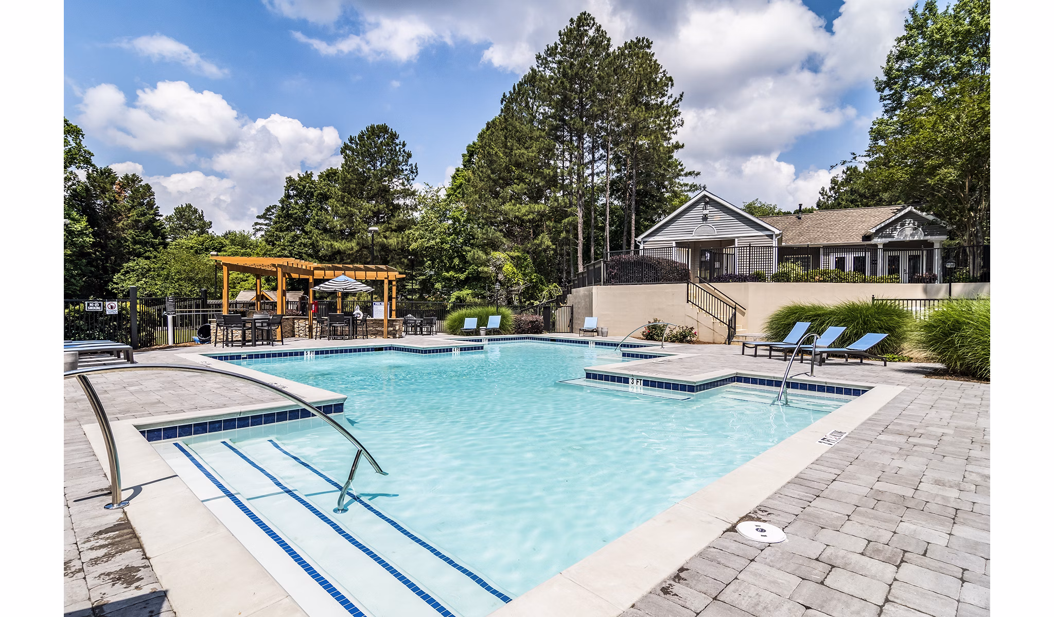 Relaxing outdoor pool at Avana Woods Apartments, perfect for leisure and exercise in a tranquil setting