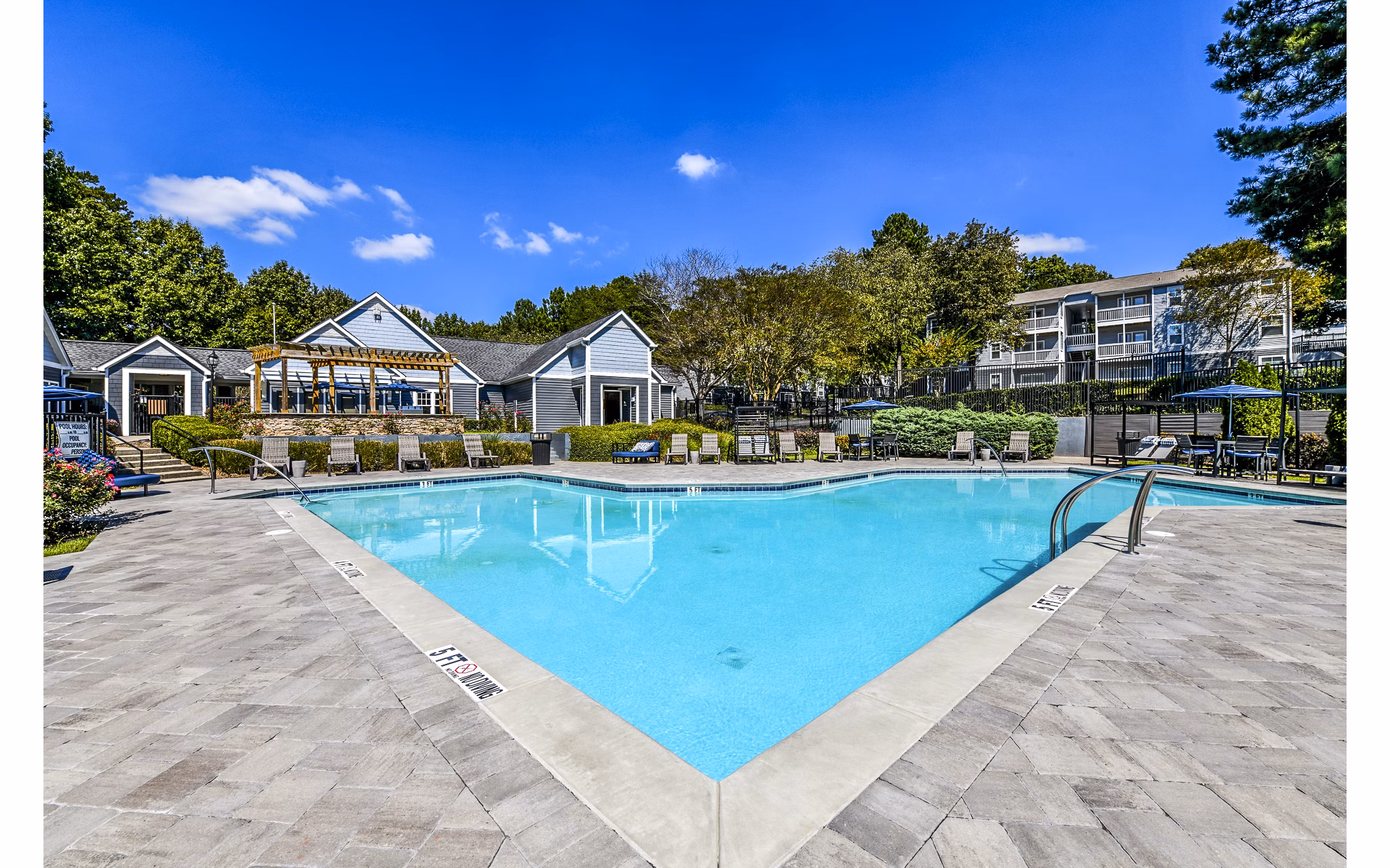 Inviting clubhouse with cozy seating and modern decor at Avana Woods Apartments
