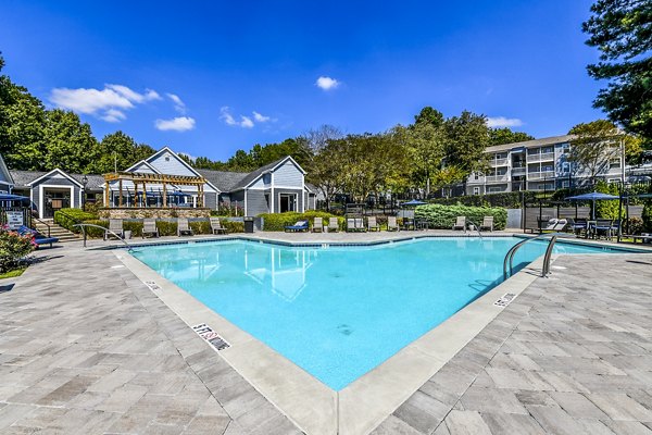 Inviting clubhouse with cozy seating and modern decor at Avana Woods Apartments