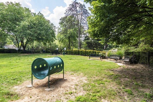 Dog park with agility equipment at Avana Woods Apartments