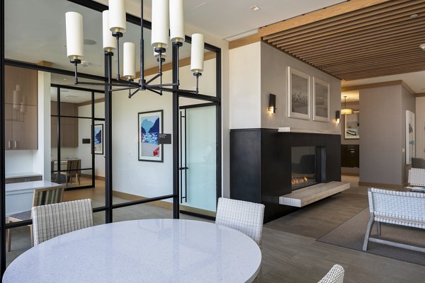 Clubhouse interior featuring modern seating and decor at Helm Apartments, a luxury property by Greystar