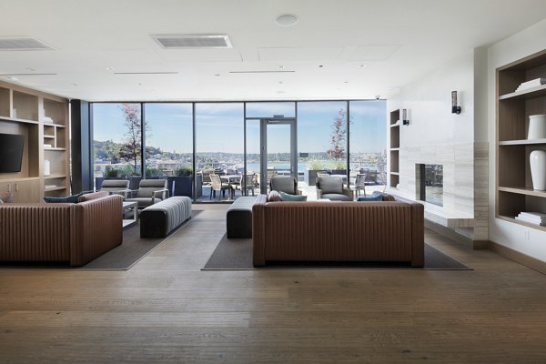 Chic clubhouse with modern furnishings at Helm Apartments, offering a stylish communal space for residents to socialize and relax