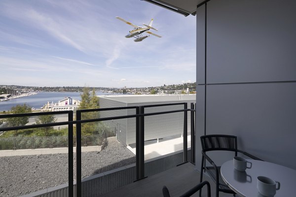 Elegant patio with modern seating at Helm Apartments, ideal for outdoor relaxation and socializing