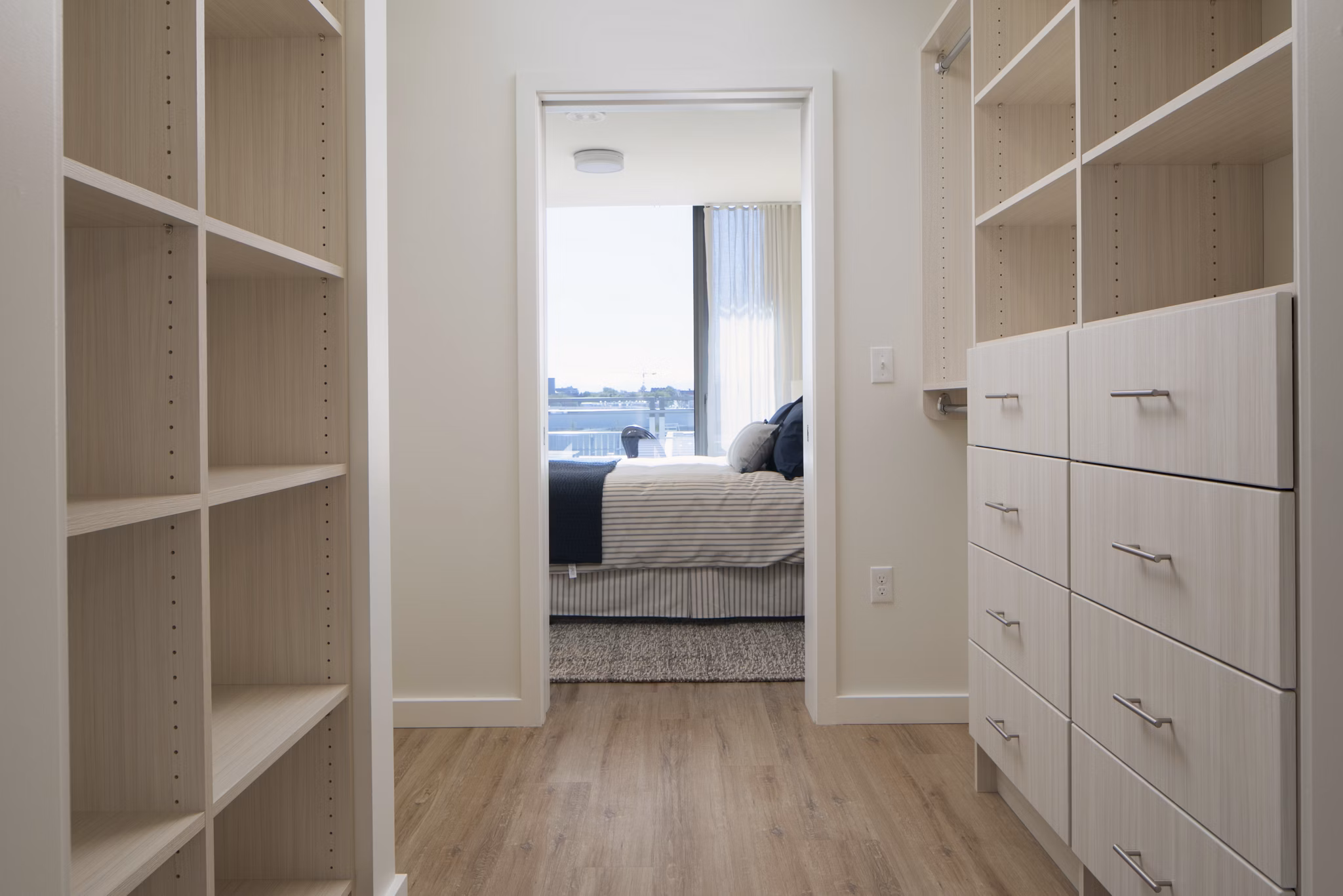 Mera Apartments: Cozy bedroom with elegant furnishings and natural light in a luxury apartment