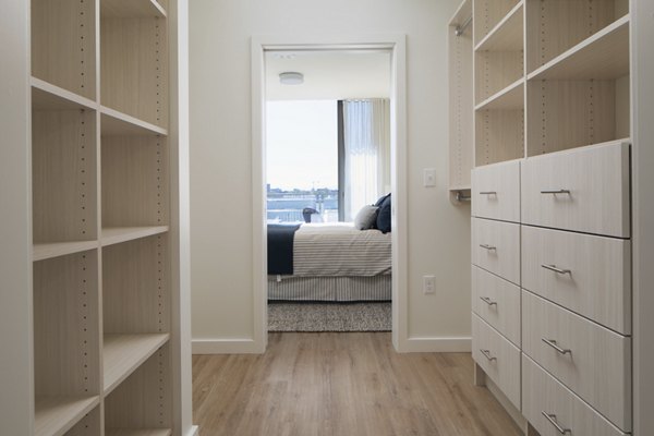 Mera Apartments: Cozy bedroom with elegant furnishings and natural light in a luxury apartment