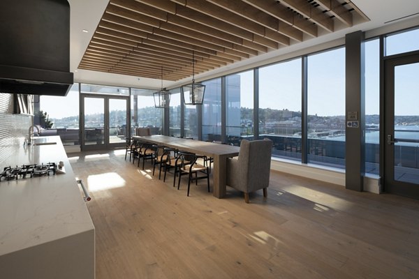 Modern clubhouse with stylish seating and open layout at Mera Apartments, ideal for social gatherings and relaxation