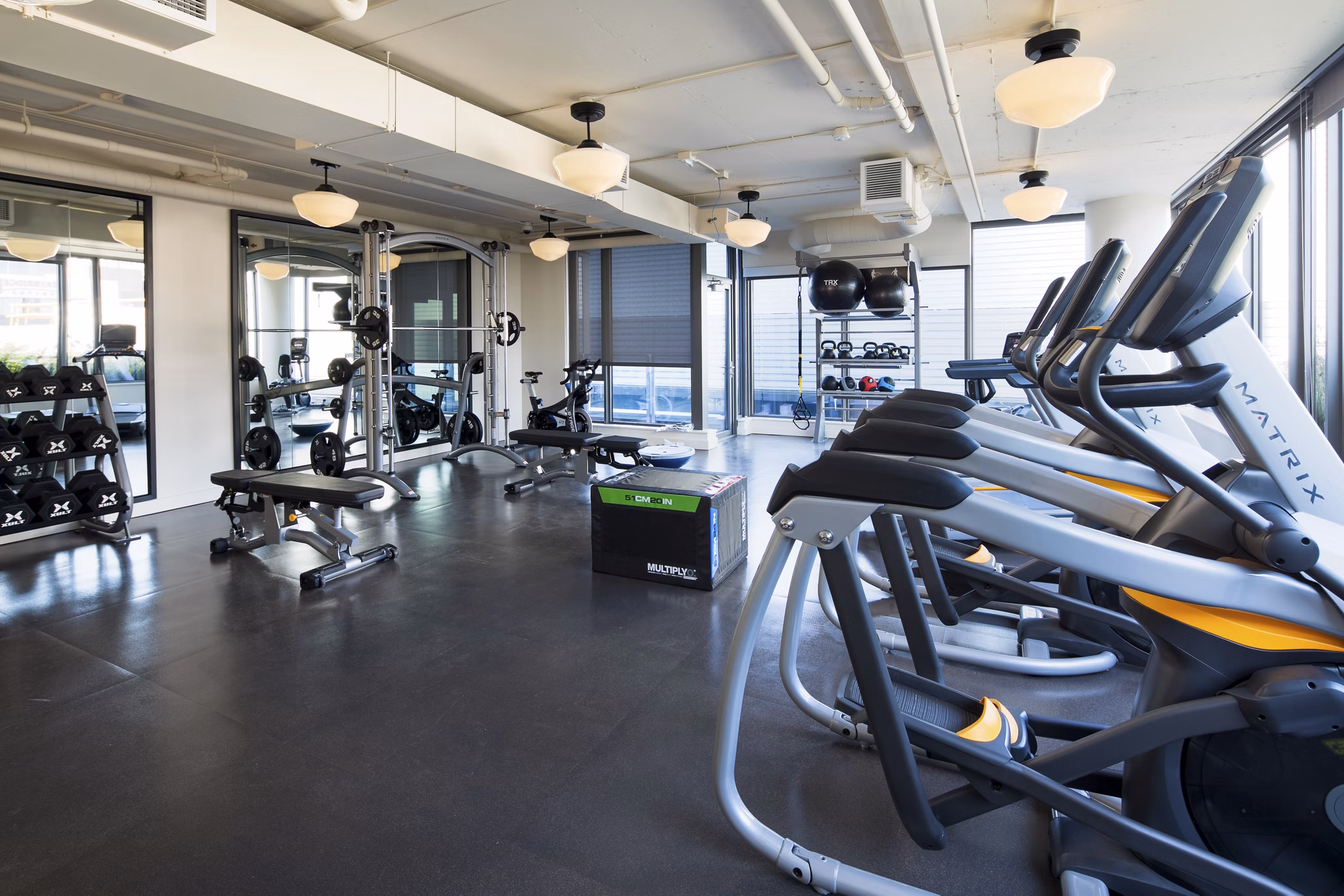 Modern fitness center featuring cutting-edge equipment at Mera Apartments, enhancing active lifestyles and wellness for residents