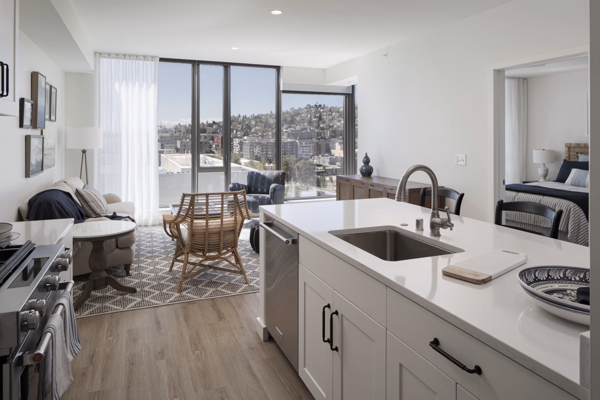 Contemporary kitchen with stainless steel appliances in Mera Apartments