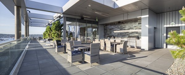 Outdoor grill area with modern stainless-steel grills at Mera Apartments, a vibrant community for social gatherings and relaxation