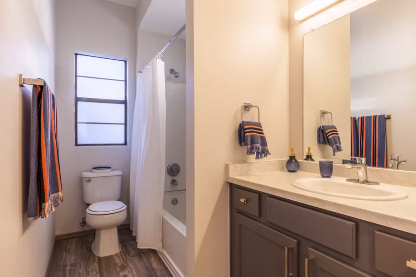 Luxurious bathroom featuring sleek fixtures and marble accents in Circ Apartments