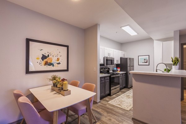 Dining area featuring modern decor and sleek furniture at Circ Apartments