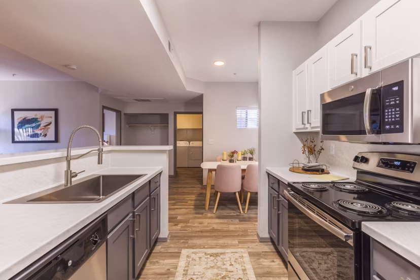 Modern kitchen with stainless steel appliances in Circ Apartments, a luxury property managed by Greystar