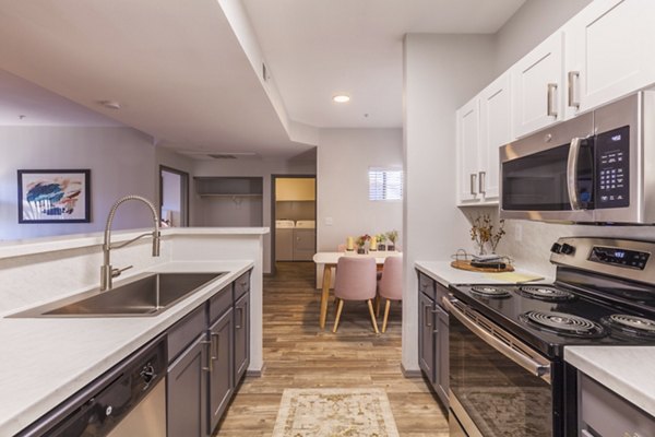 Modern kitchen with stainless steel appliances in Circ Apartments, a luxury property managed by Greystar