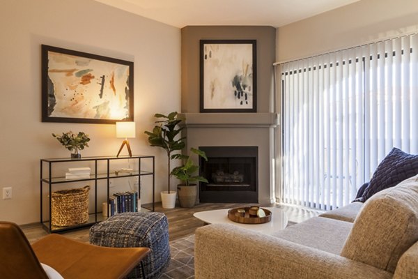 Sunlit modern living room with plush seating and sleek finishes at Circ Apartments