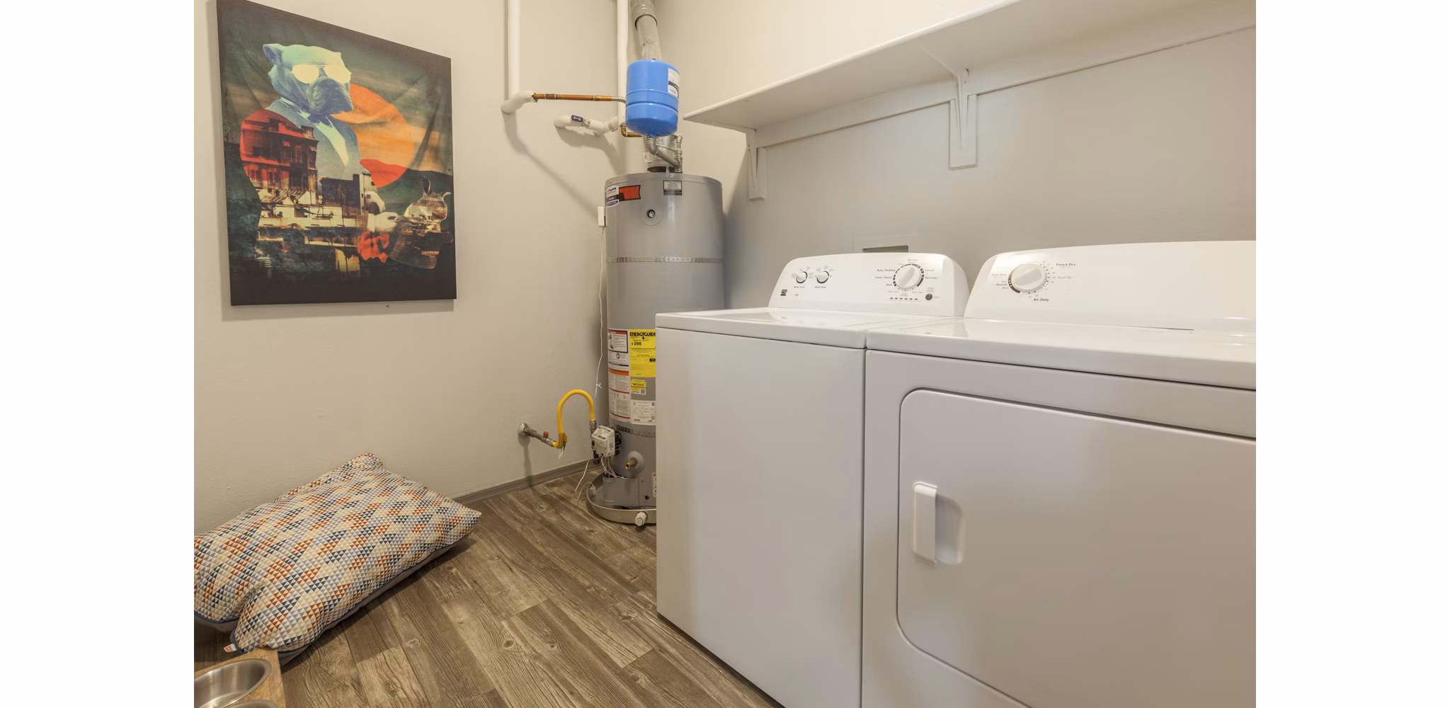 Laundry room with modern appliances at Circ Apartments - luxury living in a Greystar community