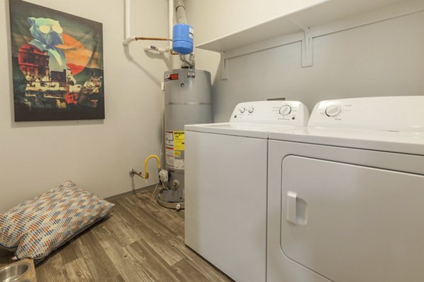Laundry room with modern appliances at Circ Apartments - luxury living in a Greystar community