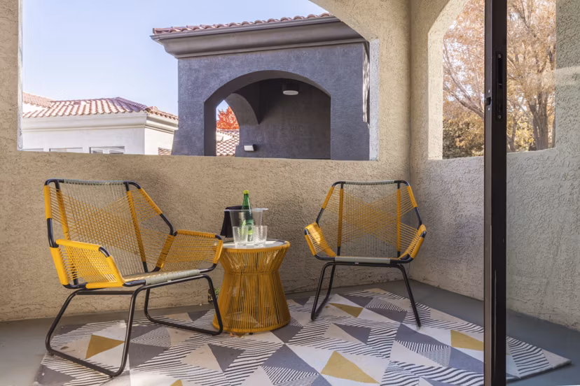 Spacious patio with outdoor seating at Circ Apartments, perfect for relaxing or entertaining guests in a luxury setting