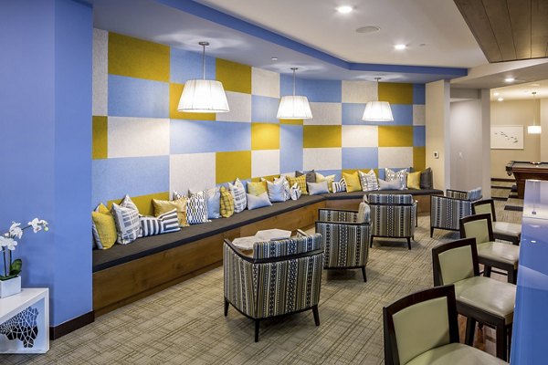 The Paxon Apartments: Stylish clubhouse with modern decor and seating areas