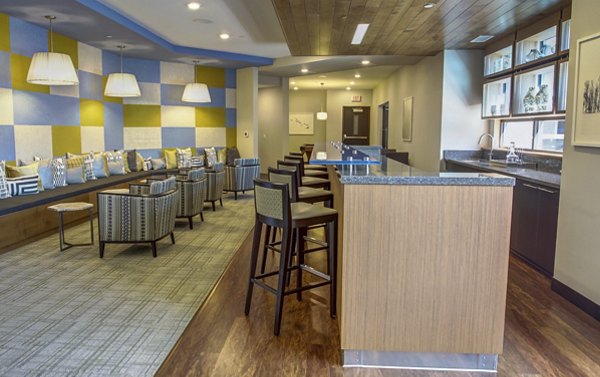 Modern clubhouse featuring luxury seating and entertainment spaces at The Paxon Apartments