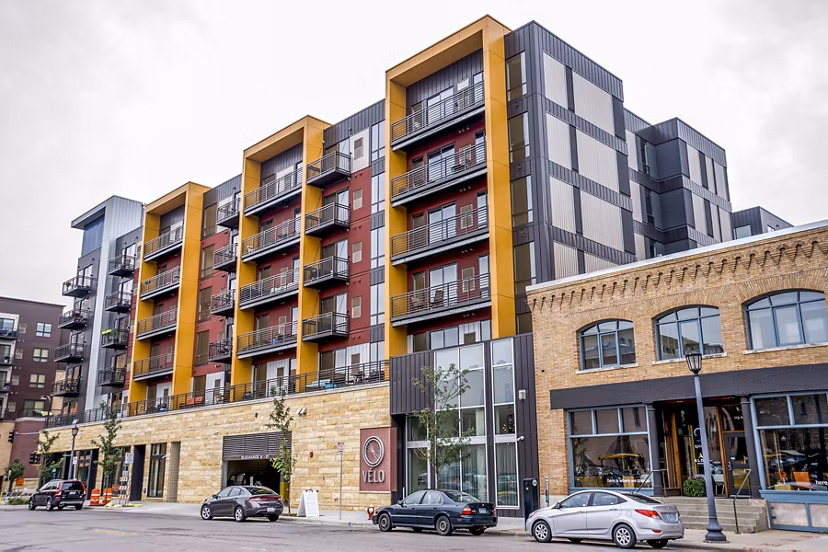 Velo Apartments: Modern building with sleek design in vibrant city setting