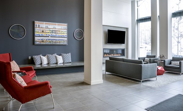 Lobby area featuring modern decor and cozy seating in Velo Apartments luxury clubhouse
